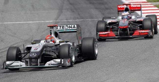 michael schumacher e jenson button formula 1 2010 espanha